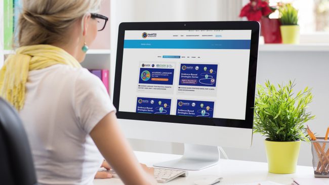 Woman working on laptop.