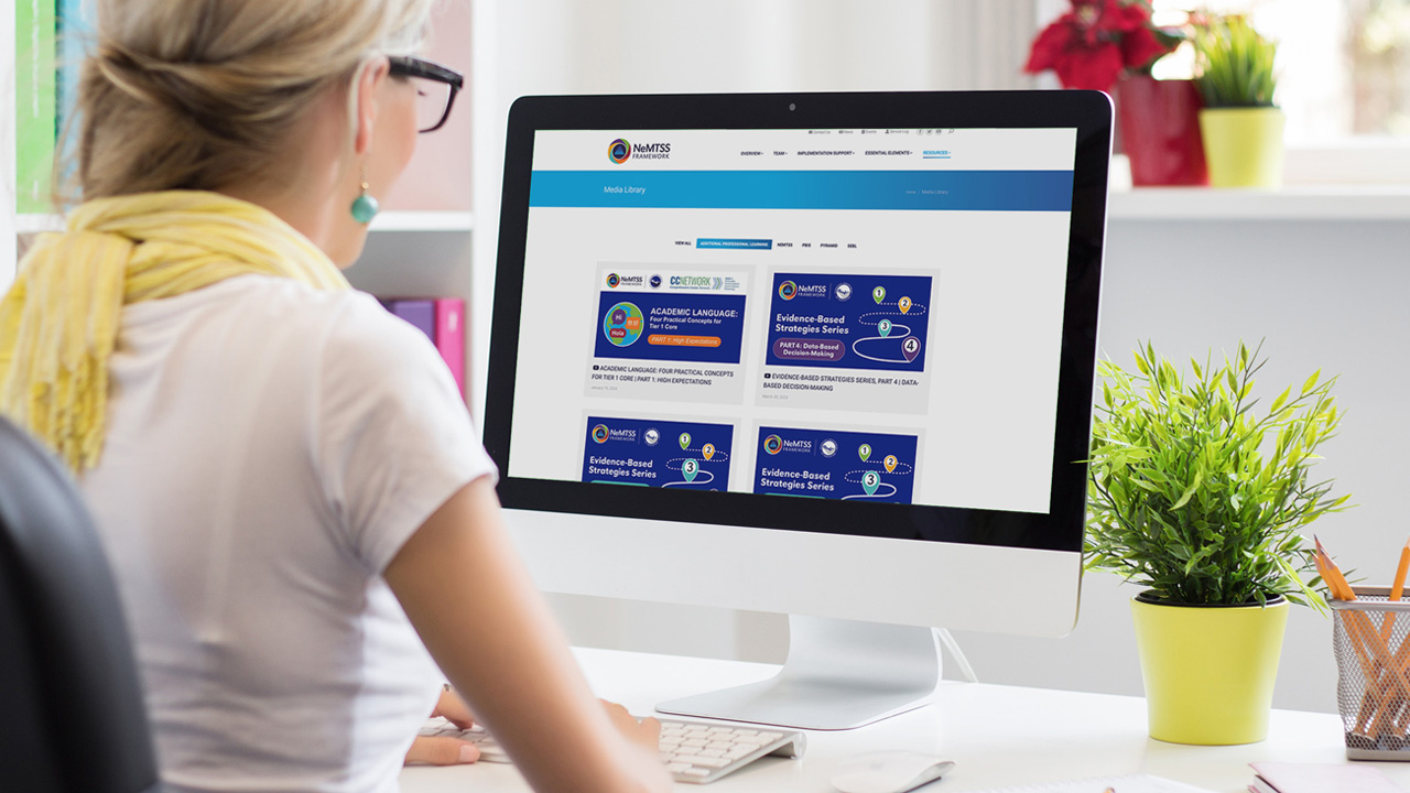 Woman working on laptop.